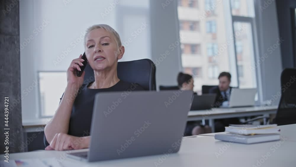 Strict boss catching female employee chatting on phone, procrastination at work Strict boss catching female employee chatting on phone, procrastination at work