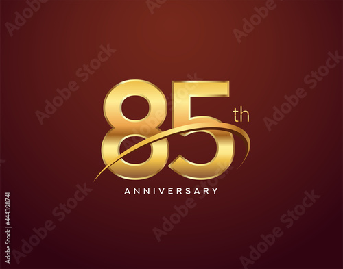 85th anniversary logotype golden color with swoosh, isolated on elegant background for anniversary celebration event.