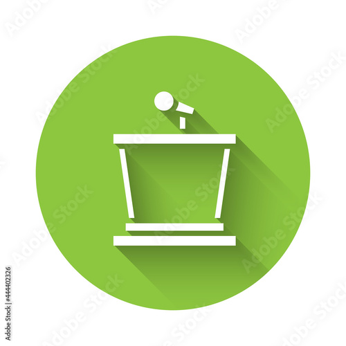 White Stage stand or debate podium rostrum icon isolated with long shadow. Conference speech tribune. Green circle button. Vector