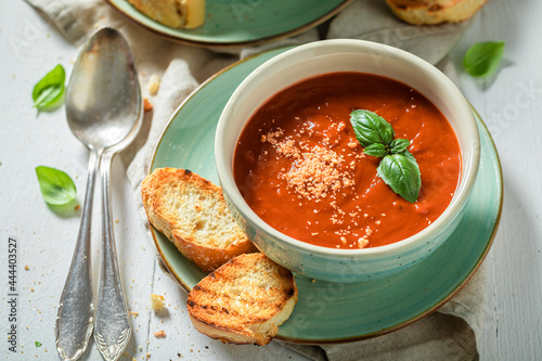 Quadro su tela Hot tomato soup made of tasty tomatoes. Soup with parmesan