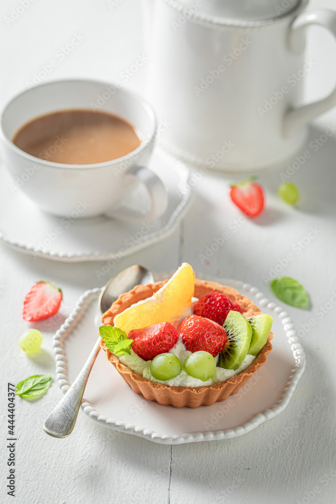Sweet mini tart with fruits and cream. Simple summer dessert. Sweet mini tart with fruits and cream. Simple summer dessert.
