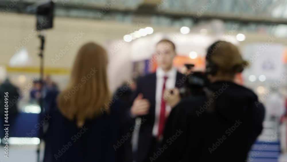 Journalists are interviewing a business person. Journalists are interviewing a business person.