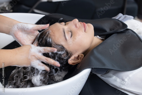Woman getting her Hair Washed and in a Beauty Salon