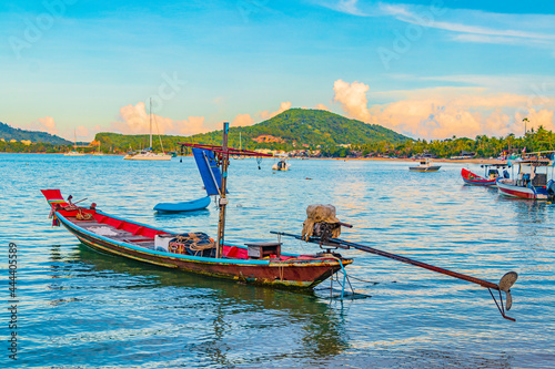 Longtail boats from fishermen on the beach Koh Samui Thailand. photo