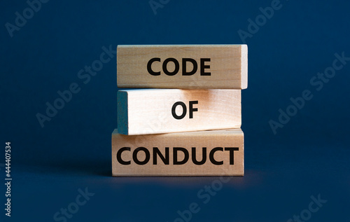 Code of conduct symbol. Concept words 'Code of conduct' on wooden blocks on a beautiful grey background. Business and code of conduct concept. Copy space.