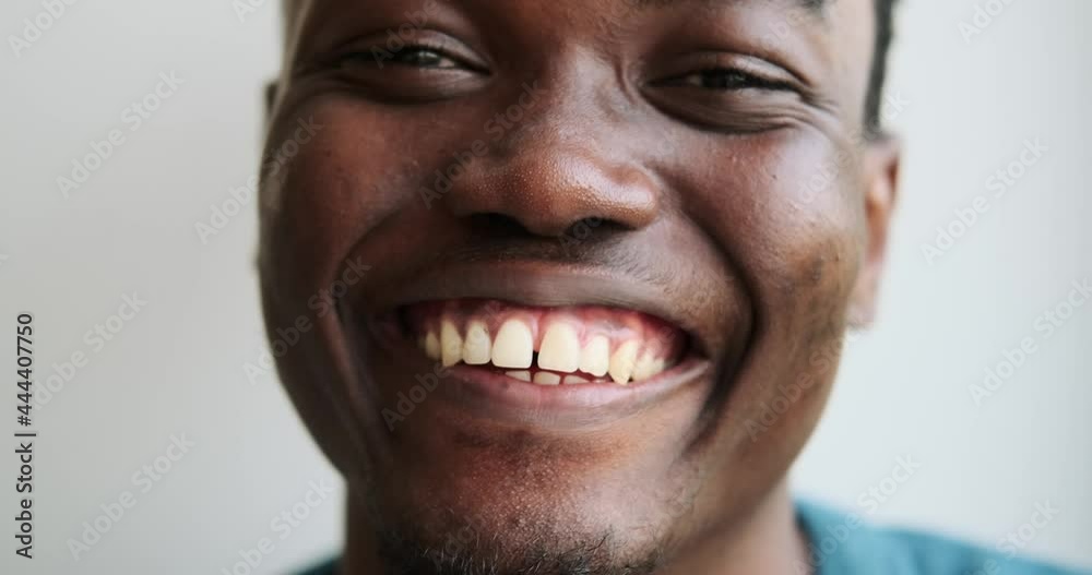 Close up face of african american man laughing Close up face of african american man laughing