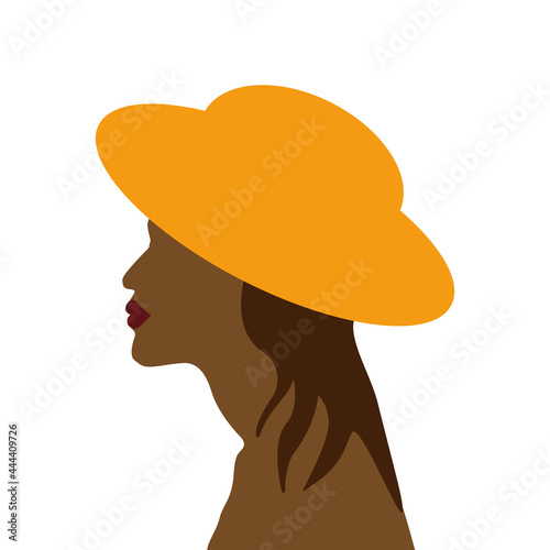 beautiful  tanned woman with long hair in a yellow hat