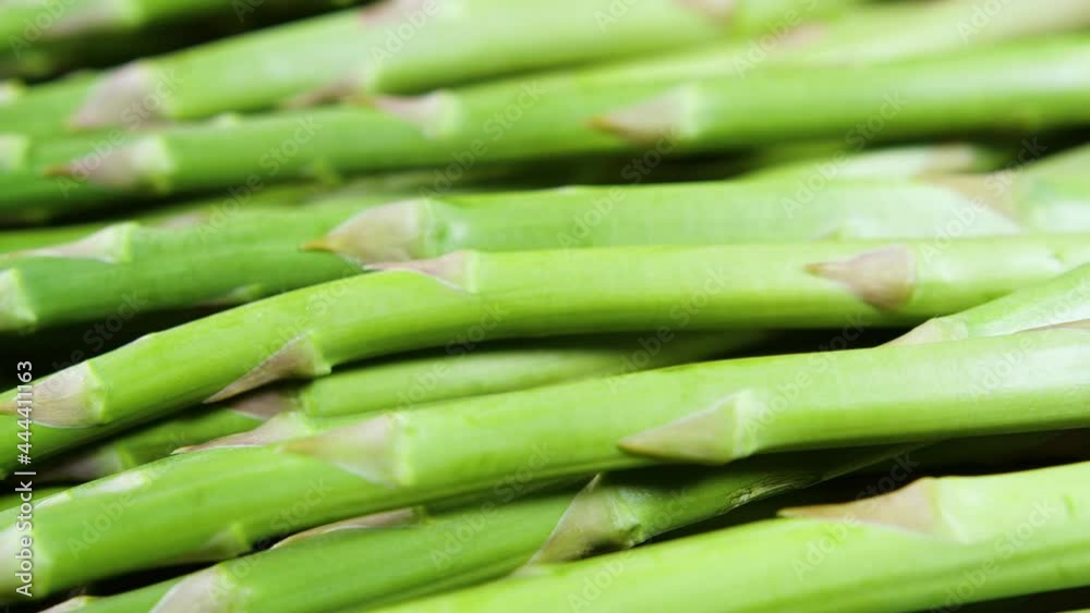 Asparagus, Fresh raw organic green Asparagus sprouts closeup, Healthy vegetarian food. Raw vegetables, market. Vegan backdrop. Slow motion 4K UHD video Asparagus, Fresh raw organic green Asparagus sprouts closeup, Healthy vegetarian food. Raw vegetables, market. Vegan backdrop. Slow motion 4K UHD video