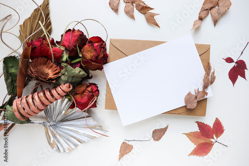 autumn bouquet of dried flowers, leaves and twigs. invitation. congratulation. space for text 