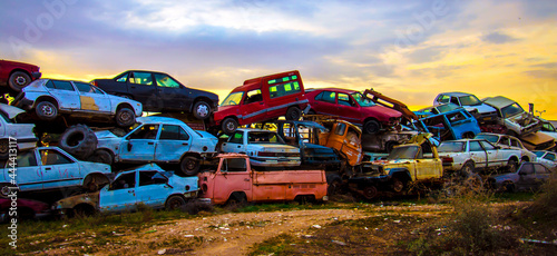  Pile of discarded cars on junkyard photo