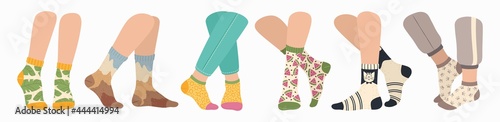 Legs in socks. Women and men wearing fashionable socks. Flat cartoon colorful sock with trendy pattern on feet, fashion accessories vector set. Clothing pieces, garment for winter season