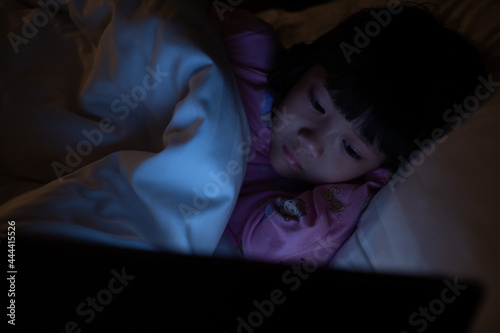 chinese child addicted phone, asian girl playing smartphone, kid watching cartoon