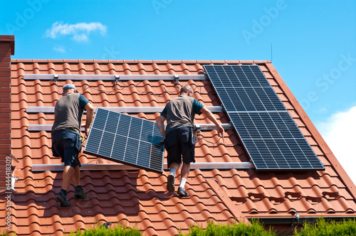 Installing solar panels on house roof