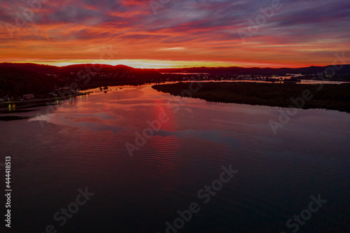 High cloud covered winter sunrise waterscape