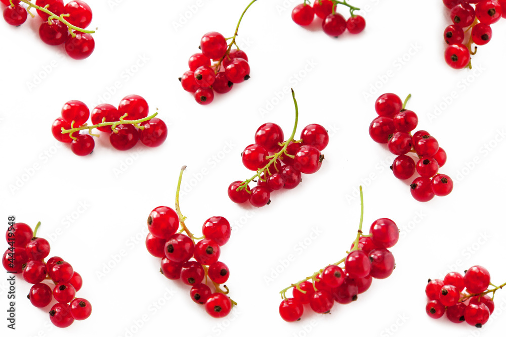Red ripe brunch of currant on white background,top view. Berries pattern. Red ripe brunch of currant on white background,top view. Berries pattern.