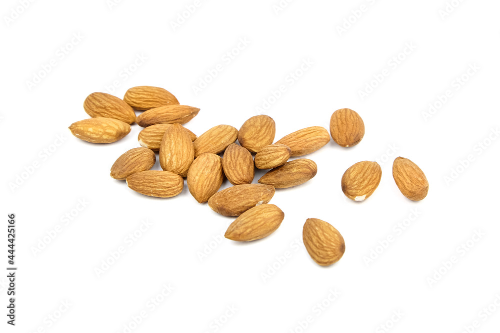 Almond nuts isolated on white background. Heap of scattered almonds Almond nuts isolated on white background. Heap of scattered almonds