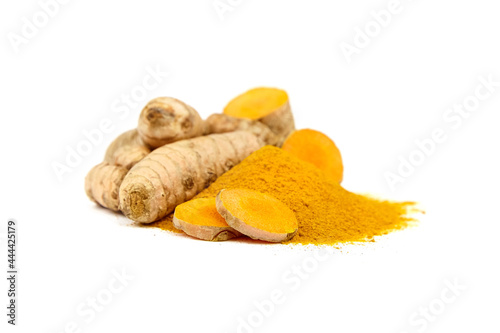 Turmeric spice, curcuma longa roots and powder isolated on white background photo