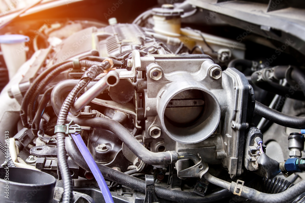 Obraz premium Close up old throttle Body of car in engine room with dust and Soot for repair and clean in process dark photo concept