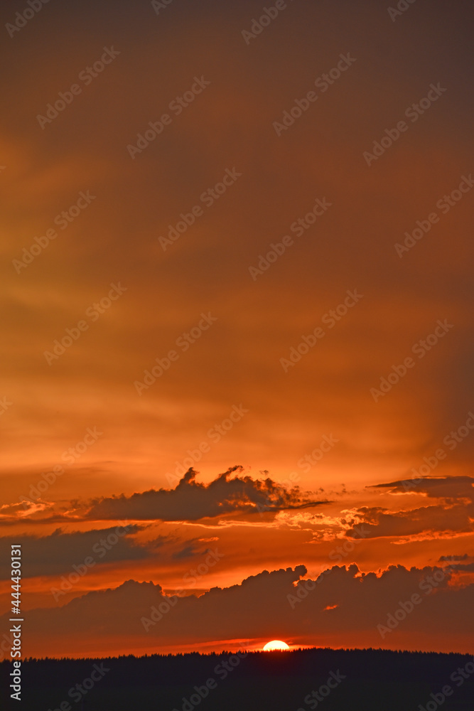 Red sunset with clouds in the evening