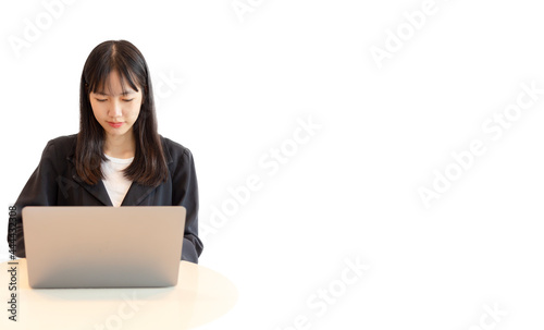 Young asian woman using laptop in white background. Beautiful asian woman working from home. selective focus on a woman.