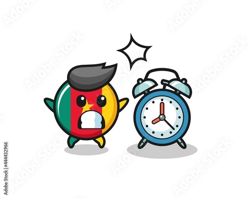 Cartoon Illustration of cameroon flag badge is surprised with a giant alarm clock