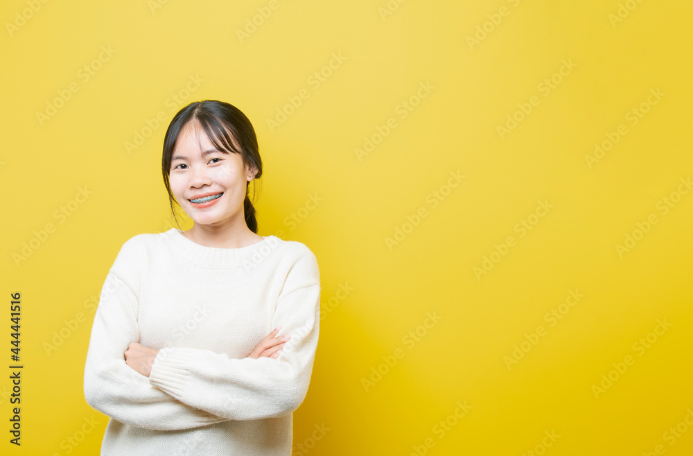 Obraz premium Photo of young attractive girl happy positive smile think hand touch chin isolated over yellow color background