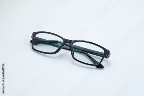 Black frame glasses isolated on white background. white board