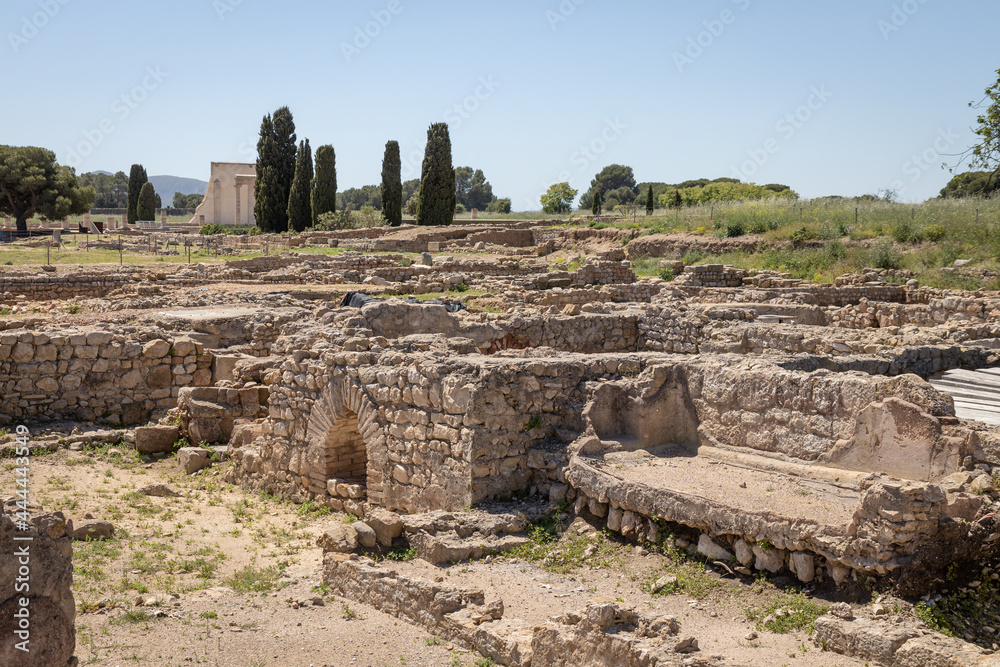 EMPURIES, SPAIN-MAY 8, 2021: Archaeological Remains of ancient city Empuries. Remains of a Greek rampart. Archaeology Museum of Catalonia, Spain.