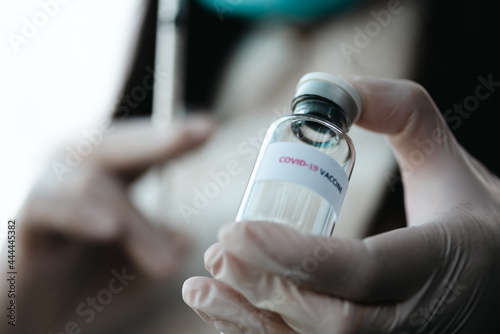 Closeup doctors or nurses provide patients with syringes for the modern Covid-19 vaccine during the global pandemic ,selective focus