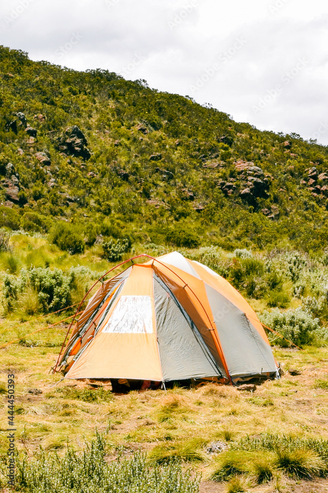 A tent against a mountain background in Mount Kenya National Park, Kenya