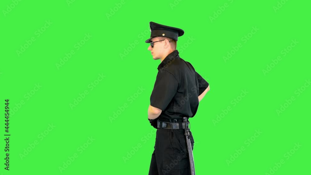 Young caucasian policeman appears, makes a shoot and walks away on a Green Screen, Chroma Key. Young caucasian policeman appears, makes a shoot and walks away on a Green Screen, Chroma Key.