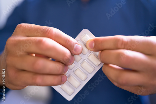 Man Using Nicotine Gum To Quit Smoking