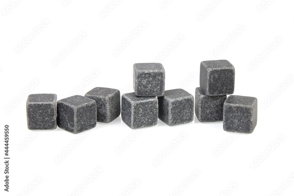 Pile of multiple whiskey cooling stone cubes on a white background Pile of multiple whiskey cooling stone cubes on a white background