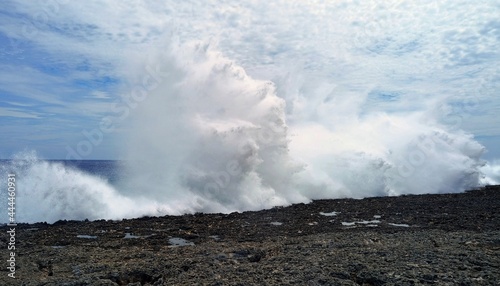 huge waves burst into the sky with gunfire like explosions