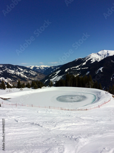 Winter snow covered mountain peaks in Austrian alps.  photo