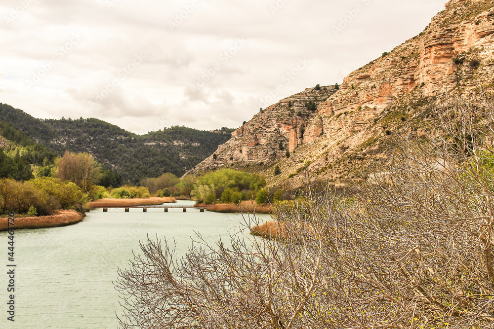 Fototapeta premium Tolosa reservoir surrounded by vegetation and mountains