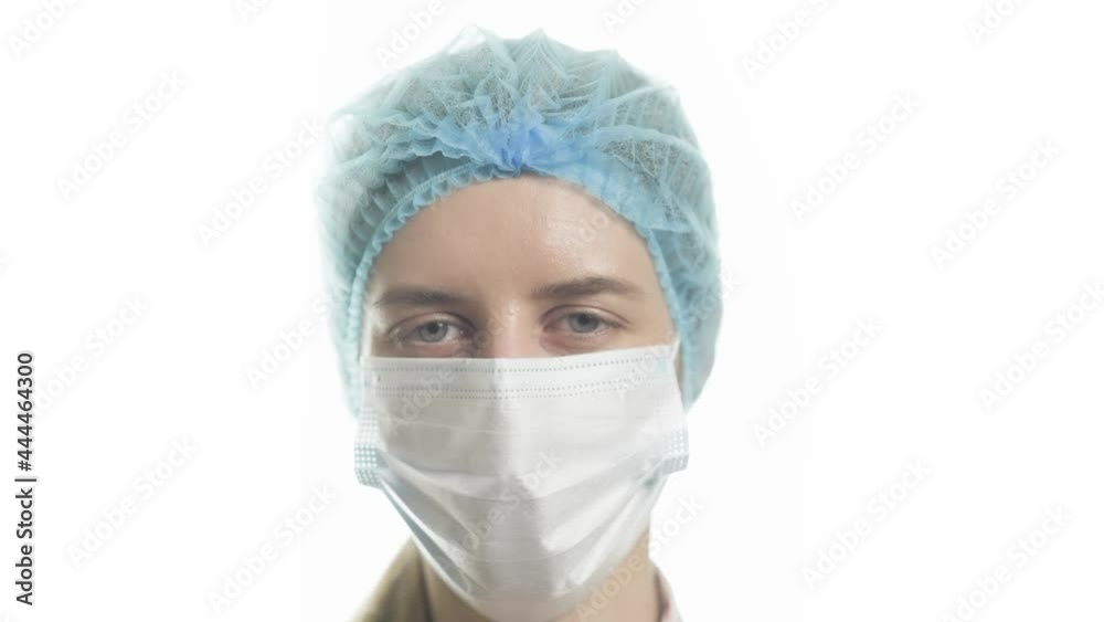 Portrait of a female doctor in medical uniform is looking at camera at hospital close up. Concept of health and treatment. Portrait of a female doctor in medical uniform is looking at camera at hospital close up. Concept of health and treatment.