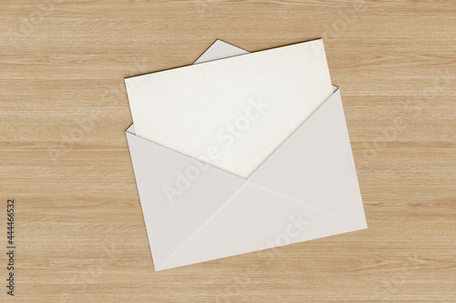 Blank card popping out of an envelope. 3d illustration.