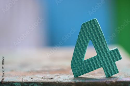 A digit 4 placed in a wooden surface