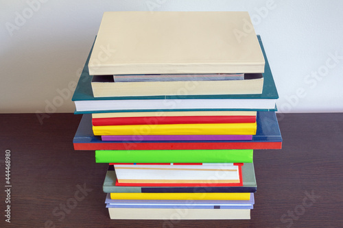 Stack of  different books on dark table. Copy space