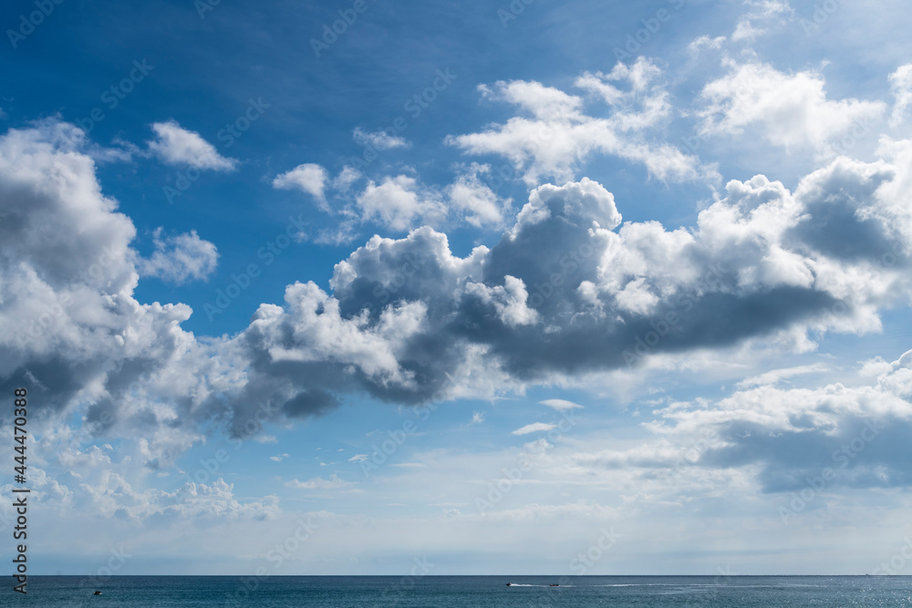  The tropical sea under the blue sky and clouds