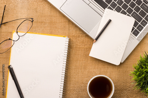 Empty notebook ready for mockup on wooden table  top view  flatlay.