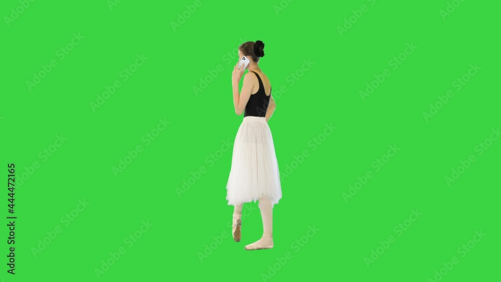 Young ballerina making a phone call on a Green Screen, Chroma Key. Young ballerina making a phone call on a Green Screen, Chroma Key.