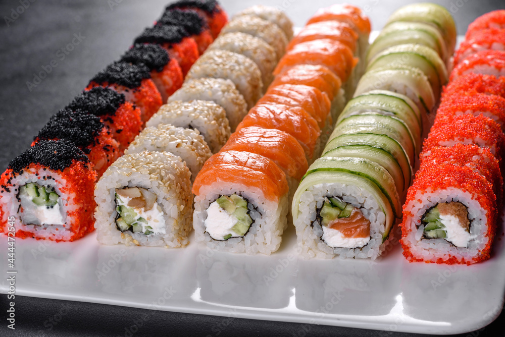 Delicious fresh rolls in various sets. Japanese food with avocado, shrimp, crab and salmon Delicious fresh rolls in various sets. Japanese food with avocado, shrimp, crab and salmon