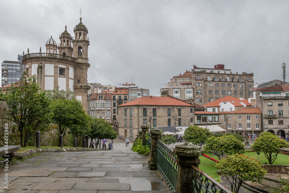 Crossing a stone bridge in the old town of Pontevedra on a typical day on the Galician Atlantic Riviera.