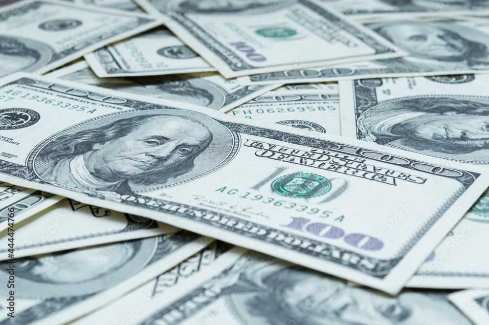 One hundred US dollars banknotes. Cash one hundred dollar bills, 100 dollars, Benjamin Franklin portrait, american currency exchange finance. Pile of hundred US dollars One hundred US dollars banknotes. Cash one hundred dollar bills, 100 dollars, Benjamin Franklin portrait, american currency exchange finance. Pile of hundred US dollars