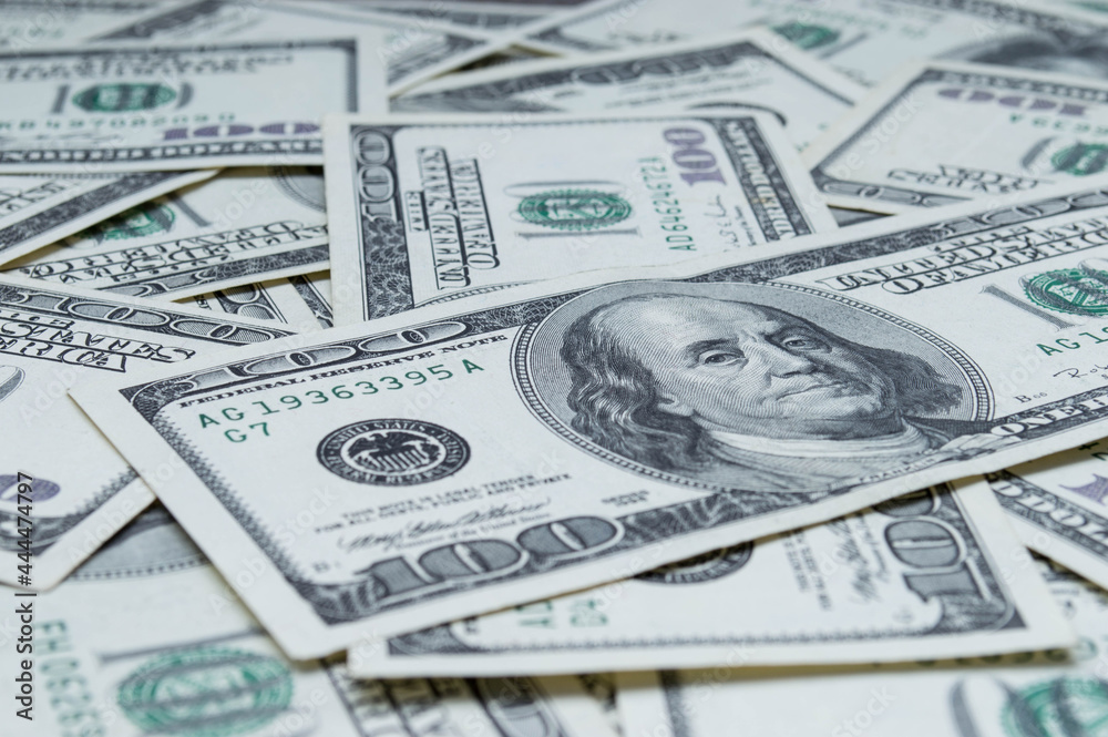 One hundred US dollars banknotes. Cash one hundred dollar bills, 100 dollars, Benjamin Franklin portrait, american currency exchange finance. Pile of hundred US dollars One hundred US dollars banknotes. Cash one hundred dollar bills, 100 dollars, Benjamin Franklin portrait, american currency exchange finance. Pile of hundred US dollars