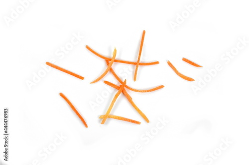 longitudinally and thinly chopped carrots isolated on white background. photo