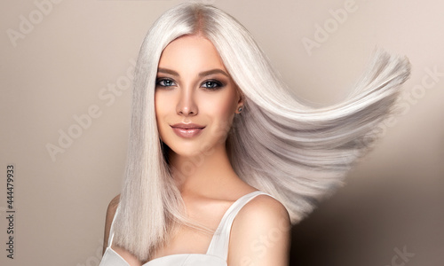 Tela Beautiful girl with hair coloring in ultra blond