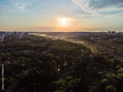 Aerial sunrise morning sky. Multistory buildings and greenery with fog at dawn in nice pastel light. View on Sarzhyn Yar in Kharkiv city.